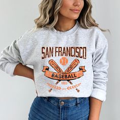 Our San Francisco Baseball Apparel is the perfect way to cheer on the home team this season. Ideal for game day, tailgates or everyday wear. Makes a great gift for any fan. SHIRT DETAILS Bella Canvas Unisex - Solid colors: 100% Cotton. - Heather colors: 52% Cotton + 48% Polyester - Runs true to size. (For looser or oversized fit consider going up a size or 2. See photos for size chart.) SWEATSHIRT & HOODIE DETAILS Gildan Heavy Blend Unisex - 50% Cotton + 50 Polyester - Runs true to size. (For looser or oversized fit consider going up a size or 2. See photos for size chart.) CARE INSTRUCTIONS Do not dryclean; Machine wash: cold (max 30C or 90F); Non-chlorine: bleach as needed; Tumble dry: low heat; Iron, steam or dry: medium heat. Wash, dry and iron inside out. MORE DESIGNS AVAILABLE https: Baseball Apparel, Hoodie Details, 1st May, Christmas Pj, February 1st, Baseball Outfit, Sports Hoodies, Baseball Fan, Home Team