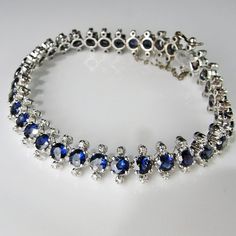 An astonishing original completely hand crafted 18K white gold 1930s line bracelet set with gorgeous blue sapphires and fine white diamonds. This sinuous and sexy original Art Deco jewel is amazingly sparkly and elegant. Each of the links moves beautifully and it drapes beautifully across the wrist due to the exceptional workmanship and delicate links. What is astonishing is the immaculate and skilled work to make each and every link by hand which is very seldom seen. You really can feel the dif Blue Sapphire Bracelet, Sparkly Bracelets, Cultured Pearl Bracelet, Heirloom Jewelry, Yellow Bracelet, Aquamarine Bracelet, Bracelet Diamond, Heirlooms Jewelry, Ceylon Sapphire