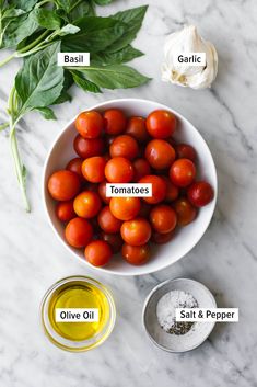 tomatoes, basil, garlic and garlic oil in a bowl