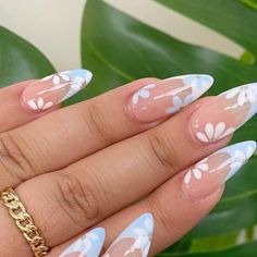 Nails, nail art, short nails, simple nails, long nails, easy nails, manicure, gel nails, almond nails, coffin nails, acrylics, square nails, round nails, french nails, french tips, green nails, nail inspiration, blue nails, purple nails, glitter nails, cuticle, quick nails, pedicure, nail polish, nail titorial, matte nails, nail dip, shellac, rings, silver ring, gold rings, finger tattoo, nude nails,beginner nails, nail gems, red nails, pink nails, white nails, black nails, orange nails, yellow nails, trendy nails, prom nails, homecoming nails, wedding nails, birthday nails Spring Nail Almond Shape, Blue Nails W Flowers, Spring Almond Shaped Nails 2024, April Almond Nails, Floral Nail Designs Spring, Spring Nails 2024 Trends French, Spring Nail Inspo Almond, Baby Blue Flower Nails, Cool Nail Inspo Spring