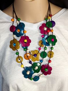 "Bright and Colorful to match most everything, this handmade Bohemian, multi layered Flower Beaded Necklace is a wardrobe must have. 30\", 15\" drop. Makes a nice gift or just for yourself. Comes in a Gift Bag." Bohemian Flower Necklace For Summer, Bohemian Brown Flower Necklace, Bohemian Multicolor Flower Necklace For Summer, Bohemian Flower Necklace For Beach, Bohemian Beach Flower Necklace, Artisan Multicolor Beaded Necklace For Beach, Multicolor Round Beads Flower Necklace For Summer, Handmade Adjustable Flower Necklace For Beach, Bohemian Flower Necklace For Summer Gift