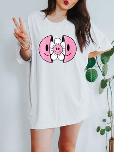 Get ready to be OBSESSED with your new Smiley Face Flower t-shirt. It's the coolest and most comfortable way to show off the latest styles. Also makes a great gift! LOOKING FOR THE HOODIE? ► https://www.etsy.com/listing/1181527971 * PRODUCT DETAILS * ↠ High Quality, Super Soft & comfy Bella + Canvas T-Shirt ↠ 100% pre-shrunk cotton (heather colors are a poly-cotton blend) ↠ This is a direct-to-garment print, no vinyl or stencils. Which means it will last a lot longer! ↠ Printed in and Shipped fr White Cartoon Print T-shirt For Spring, White T-shirt With Funny Print For Spring, Cute Oversized T-shirt For Spring, White T-shirt With Cartoon Print For Spring, Cute Oversized White T-shirt, Cute Graphic Design Tops For Spring, Cute Graphic Design T-shirt For Spring, White Graphic Design Shirt For Spring, Cute Oversized Spring T-shirt