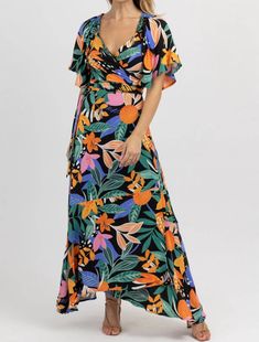 Multifloral Wrap Maxi Dress In Bora Black Tropical Maxi Dress With Vibrant Print And V-neck, Multicolor V-neck Wrap Dress For Vacation, Tropical Print Short Sleeve Maxi Dress For Garden Party, Floral Print Wrap Dress For Vacation, Spring Vacation Wrap Maxi Dress, Bohemian Multicolor Maxi Dress With Surplice Neckline, Bohemian Floral Print Wrap Dress For Vacation, Floral Print Wrap Dress For Beach, Floral Print Maxi Wrap Dress For Vacation