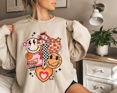 "Get ready to rock that casual chic look with our Basketball Sweatshirts For Women ❤️ Get retro with this retro basketball sweatshirt! This design is perfect for all cool basketball girl / women \"basketball mama, basketball wife or just a basketball game lover\" out there. Show off your retro style and spread basketball season vibes with our basketball sweatshirts. ❤️ Size up, babe! Go 1-2 sizes bigger for that oversized stunner. Elevate your style, own the spotlight, and unleash your fashion power. It's time to rock the room with your effortlessly chic vibe. Get ready to slay in style! Elevate your style with our collection of hand-printed shirts that effortlessly blend comfort and style. With playful wit and relatability, our designs capture the essence of carefree vibes, no matter the Retro Graphic Print Sweatshirt For Game Day, Retro Graphic Print Sweatshirt For College, Retro Relaxed Fit Tops For Game Day, Retro Sweatshirt With Graphic Print In Relaxed Fit, Retro Oversized Tops For Game Day, Oversized Retro Top For Game Day, College Style Game Day Sweatshirt With Graphic Print, College Style Sweatshirt With Graphic Print For Game Day, College Style Graphic Sweatshirt For Game Day