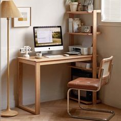 a wooden desk with a computer on top of it