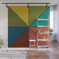 an abstract wall mural with multicolored geometric shapes