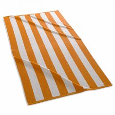 an orange and white striped napkin on a white background