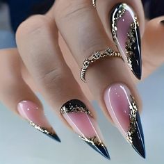 a woman's hand with black and pink stiled nails