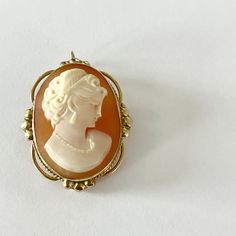 This gorgeous 1950s Admark Cameo Brooch is in spectacular condition. It has a loop clasp so that it can also be worn as a pendant on a necklace.  Measures 1 1/4 inch X 1 inch Marked 14k / ADMARK Please contact me with any questions. Mid-century Cabochon Brooch For Gift, Mid-century Cabochon Brooch Gift, Mid-century Cabochon Brooches For Gifts, Elegant Medallion Brooch For Collectors, Formal Retro Pendant Jewelry, Elegant Medallion Shaped Brooch Jewelry, Elegant Medallion Shaped Brooch, Retro Formal Pendant Jewelry, Retro Pendant Jewelry For Formal Occasions