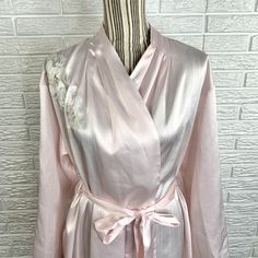 Vintage light pink satin robe featuring a sheer embroidered floral design by Vandemere. Size Large. Closure: Tie, Button, BeltMaterial: 100% Polyester Measurements Bust: 46”+Shoulder to Hem Length: 37”Sleeve Length: 22”S21 Pink Satin Finish Robe For Wedding, Spring Wedding Satin Sleepwear, Pink Fitted Robe For Wedding Night, Pink Silk Wedding Robe, Pink Satin Robe With Satin Finish, Pink Long Sleeve Satin Robe, Long Pink Robe For Wedding, Feminine Spring Wedding Robe, Pink Long Sleeve Wedding Robe