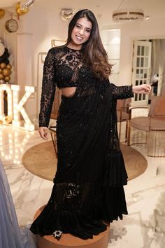 Black pre-draped saree crafted in net and satin silk with midnight bloom garden embroidery using tonal sequins, beads highlights and frilly ruffle detailing on the saree skirt and pallu. Paired with a full sleeves sequin fleur garden embroidered sheer blouse. - Aza Fashions Black Saree With Full Sleeve Blouse, Embellished Pre-draped Saree For Diwali Evening, Evening Party Wear Pre-draped Saree With Mirror Work, Party Wear Evening Saree With Sequins, Glamorous Evening Choli In Georgette, Evening Embellished Pre-draped Georgette Saree, Glamorous Evening Georgette Choli, Evening Sequined Georgette Lehenga, Glamorous Evening Pre-draped Saree With Sequins