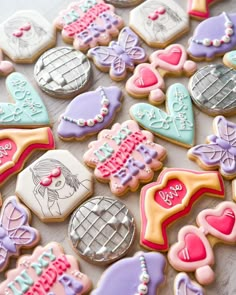 decorated cookies are arranged on a table