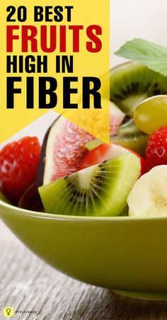 a green bowl filled with fresh fruit on top of a wooden table and text overlay reads 20 best fruits high in fiber