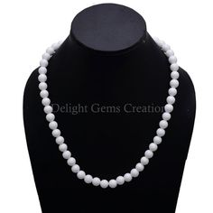 Product Details : Item Code : DGC080Gemstone Name :  WHITE CORALChain Style : BEADEDBeads Shape : SMOOTH ROUNDBeads Size : 8 MM ApproxLength : 18" Inch ApproxWeight : 255 Cts. ApproxCustomization : **Available**Please Feel Free To Contact If You Have Any Query. White Faceted Beads Jewelry As Gift, White Faceted Beads Jewelry For Gifts, Pearl White Gemstone Bead Necklace For Gifts, Pearl White Gemstone Beads Necklace As Gift, Pearl White Gemstone Beads Necklace For Gift, Pearl White Single Strand Necklace With Round Beads, Pearl White Necklace With Gemstone Beads As Gift, Classic White Pearl Necklace With Round Beads, Classic White Jewelry With Polished Beads