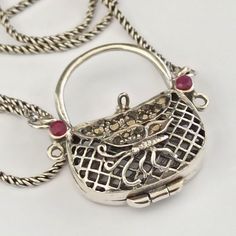 Purse Silver Locket Necklace Tested Ruby Mesh Butterfly Small Bag Unique Gift ·         measures : 67 cm / 26 inch long + pendant 3 cm / 1.2" long , 14.4 g ·         sterling silver 925 & natural Ruby ·         locket  ·         signed 925 I combined shipping and send ASAP  "Dead" stock New old stock - NOS, never used, liquidated from shop International shipping: Import duties, taxes, charges, delays or prohibitions at customs are the buyer's responsibility. Ruby Locket, Silver Locket Necklace, Silver Locket, Silver Lockets, Long Pendant, Natural Ruby, Fine Jewellery Necklace, Locket Necklace, Small Bag