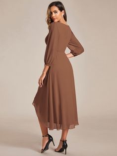 Step into the spotlight at your next wedding as a distinguished guest with this long sleeves asymmetrical hem A-line midi dress. The elegant A-line silhouette flatters every body type, while the asymmetrical hemline adds a contemporary twist. The long sleeves provide a touch of modesty, making it perfect for any wedding setting. Whether it's a garden ceremony or a romantic evening reception, this dress will ensure you are the epitome of sophistication and style. Fit: Please refer to size chart. Length: Midi length. Sleeve Style: Long sleeves. Closure: It is concealed a zipper up the back. Undergarments: It is not padded, no lining. Fabric:The garment comprises polyester. Stretch: Fabric is low stretch. Midi Wedding Guest Dress, Semi Formal Wedding, Goddess Gown, Beachside Wedding, Brown Midi Dress, Mid Dress, Tea Length Dresses, Guest Dress, Mid Dresses