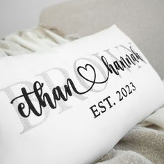 a personalized pillow with the name and date on it