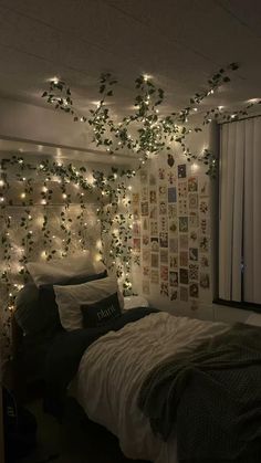 a bedroom with lights strung from the ceiling