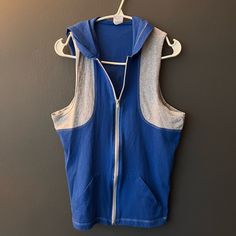 Never Worn Blue/Grey Zip-Up Sleeveless Hoody Casual Sleeveless Hoodie For Workout, Casual Hooded Tank Top For Sports, Blue Stretch Sports Vest, Blue Sporty Vest For Sports, Sporty Blue Sports Vest, Blue Sporty Workout Vest, Sporty Blue Vest For Workout, Sporty Blue Workout Vest, Casual Blue Sports Vest