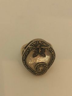 Vintage hand made about an in long Mother of Pearl set in 925 Sterling Silver Marcasite ring I have size 5.5 Can be re sized for you, my jeweler would charge $10 All rings are shipped in a nice gift box. Check out our over a THOUSAND great reviews Engraving is $4 per letter and is not always perfect depending on the piece. It can take a few days if the jeweler is busy. This is payable to Paypal Judithsltd@gmail.com Victorian Pearl Ring Gemstone Gift, Victorian Pearl Ring With Gemstone For Gift, Victorian Pearl Ring Gift, Victorian Style Pearl Ring Gift, Antique Style Open Ring Jewelry, Stamped 925, Antique Open Ring Jewelry Stamped 925, Antique 925 Stamped Open Ring, Antique Open Ring Jewelry For Gift, Antique Sterling Silver Ring