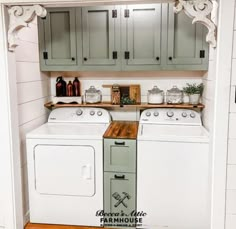 a kitchen with green cabinets and white washer and dryer