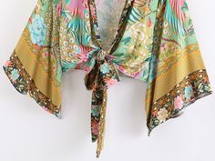 Our beautiful Metella Boho Kimono has a bold and vibrant floral with peacocks print design. Made from a lightweight cotton blend that will look great both as a summer layer or on the beach.Specs: Material: Cotton/ Rayon Fits true to size, take your normal size Bohemian Top With Bold Print For Spring, Bohemian Bold Print Top For Spring, Bohemian Tops With Bold Print For Spring, Bohemian V-neck Tops With Tropical Print, Patterned Hawaiian Tops For Spring, Hawaiian Patterned Tops For Spring, Spring Hawaiian Patterned Tops, Tropical Patterned Tops For Summer, Multicolor Print Beachwear Tops For Vacation