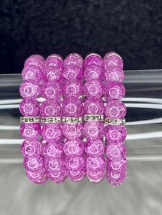 Royal Arm Candy Individual Bracelets features 8mm or 10mm beads with silver accents, making it the ideal accessory to adorn your arm and amplify its allure. What do you get: 1 bracelet Fits a 7" wrist but can stretch bigger 10mm beads Party Stretch Bracelet With Polished Round Beads, Purple Stretch Bracelet With Round Beads For Party, Silver Stretch Bracelet With 8mm Beads, Adjustable Stretch Bracelet With Large Beads For Party, Silver 8mm Beads Stretch Bangle Bracelet, Silver Stretch Bangle With 8mm Beads, Adjustable Large Bead Stretch Bracelet For Party, Adjustable Large Beads Stretch Bracelet For Party, Adjustable Large Beaded Stretch Bracelet For Party