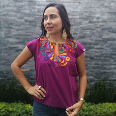 Beautiful colorful Hand Embroidered Mexican Flower Shirt made in Chiapas, Mexico. Cotton Shirt can be machine washed in cold water, hang to dry and warm iron. Each shirt is hand embroidered and flower will vary but each one is beautiful and unique Any questions please feel free to contact me DOES NOT INCLUDE THE BELT Embroidered Bohemian Purple Blouse, Bohemian Embroidered Purple Blouse, Purple Embroidered Bohemian Blouse, Bohemian Purple Blouse With Floral Embroidery, Bohemian Purple Embroidered Blouse, Bohemian Purple Top With Floral Embroidery, Purple Bohemian Top With Floral Embroidery, Purple Embroidered Short Sleeve Top, Casual Embroidered Purple Blouse