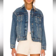 Your New Go-To Trucker Jacket Featured In A Button-Front, Oversized Silhouette And Classic Denim Fabrication For Goes-With-Anything Style From Season To Season. Classic Collar Detail Subtle Distressing For A Lived-In Look Front Button Closures Breast Flap Pockets And Side Welt Pockets Buttoned Cuffs Oversized Denim Jacket With Button Closure For Everyday, Oversized Blue Denim Jacket With Buttons, Oversized Blue Outerwear With Buttoned Pockets, Oversized Blue Denim Jacket With Buttoned Pockets, Blue Outerwear With Buttoned Pockets And Relaxed Fit, Medium Wash Outerwear With Snap Buttons And Relaxed Fit, Classic Oversized Collared Denim Jacket, Blue Relaxed Fit Denim Jacket With Snap Buttons, Relaxed Fit Blue Denim Jacket With Snap Buttons