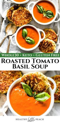 two bowls of roasted tomato soup with basil leaves on top