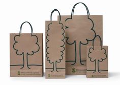 three bags with trees drawn on them