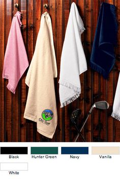 several towels hanging on the wall in different colors