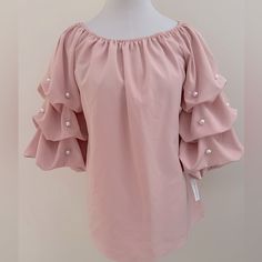 3/4” Puffy Ruched Sleeves Off Shoulder Top Elastic Detail On Shoulder And Sleeve Pearl Accents On Sleeves Laying Flat: - 18” Pit-Pit - 21.5” Length Bin# 10 Bag# 1-0356 Elegant Pink Tops For Brunch, Trendy Pink Top With 3/4 Sleeves, Trendy Pink Tops With 3/4 Sleeve, Spring Party Blouse With Half Sleeves, Pink Feminine Blouse For Brunch, Feminine Pink Blouse For Brunch, Chic Pink Half Sleeve Tops, Feminine Ruffled Blouse With 3/4 Sleeves, Elegant Pink Blouse With 3/4 Sleeves