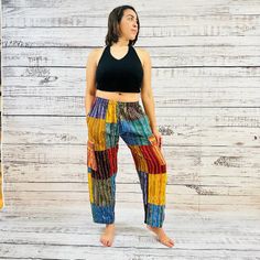 Unisex Patchwork Palazzo Pant is a stylish yet practical combination of easy comfort and functionality. Crafted from a blend of organic cotton, these handmade trousers feature a patchwork design and four pockets for added convenience. The adjustable elastic waist and drawstring ensure a perfect fit. These pants are handwoven and of which the prints will be slightly different in each pair. Thai Clothes, Palazzo Pant, Patchwork Designs, Palazzo Pants, Elastic Waist, Hand Weaving, Perfect Fit, Organic Cotton, Size 10