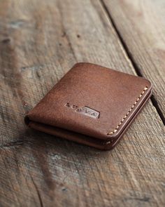 Unique design and convenient to use. Traveler's Wallet is a handmade leather wallet that can carry up to 8 cards and unfolded cash. This bi-fold wallet will look even better when aged as it's made with Italian vegetable tanned full grain leather. The leather has a beautiful rugged texture which turns darker and shinier over time. No need to use any leather balm as the oils in its users hands will take care of the leather. Choose from several color options. The dimensions: 7,7 cm x 10 cm (3" x 3. Minimalist Brown Wallet With Coin Pocket, Minimalist Brown Trifold Wallet For Everyday, Handmade Minimalist Brown Wallet, Handmade Leather Work, Diy Leather Projects, Leather Wallet Pattern, Brown Leather Wallet, Leather Company, Pocket Card