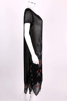 For Sale on 1stDibs - Vintage Couture c.1920's black silk georgette beaded flapper dress. Multicolor floral glass beaded embellishment along front, hemline, neckline, and cuffs. 1920s Beaded Fitted Dress, 1920s Fitted Beaded Dress, 1920s Beaded Fringe Evening Dresses, 1920s Style Beaded Fringe Evening Dresses, 1920s Evening Dresses With Beaded Fringe, Black Sequined Art Deco Flapper Dress, Black Art Deco Flapper Dress With Sequins, Vintage Black Flapper Dress With Beaded Fringe, 1920s Black Flapper Dress For Cocktail