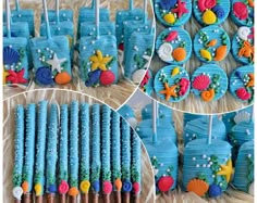 there are many decorated cupcakes and cookies in the shape of ocean animals on sticks