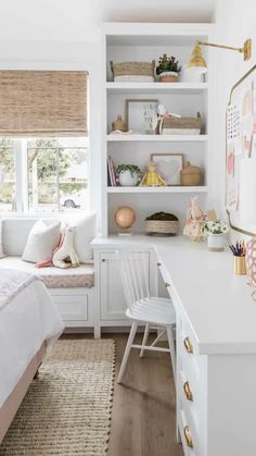 a bedroom with white walls and shelves filled with books, toys, and other items