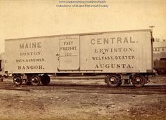 an old photo of a train car on the tracks in front of some other cars