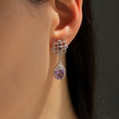 ✨💎 It gives you beautiful, attractive and outstanding jewelry experience ✨ * Everlasting Confidence * Wonderful Quality * Stay Shiny * Exquisite Fit Unveil Your Elegance with Our Limited Edition Sterling Silver Purple Chandelier Earrings Meet our Limited Edition Sterling Silver Purple Chandelier Earrings, the epitome of timeless elegance, and the perfect accent to your favorite outfits. These exquisite pieces will undoubtedly make you feel like royalty with their unique royal crest filigree design. Incredible Features for an Extraordinary You * Opulent Oval Purple Stone: The simulated amethyst stone makes a captivating centerpiece. Its enchanting purple color not only exudes luxury, but it also breathes life into any ensemble. * Sophisticated Sterling Silver: Rhodium-plated for a lustrous Purple Chandelier, Purple Dangle Earrings, Royal Crest, Filigree Design, Earrings Women, Purple Stones, Amethyst Stone, Earrings Sterling Silver, Bridal Gifts