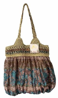 NWT Cappelli Straworld shoulder bag. The multicolored bohemian pattern and woven raffia and fabric exterior. The snap closure and shoulder strap handle style provide convenience and comfort, while the interior and exterior pockets offer ample storage space. The bag is made of a cotton blend and straw material, with a fabric lining in a light brown color. Multi Colored Bag, Light Brown Color, Bohemian Pattern, Woven Raffia, Beach Travel, Boho Bag, Beach Trip, Storage Space, Brown Color