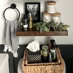 the bathroom is decorated with candles, towels and other things to put on the shelves