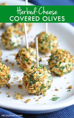 some food is on a white plate with toothpicks