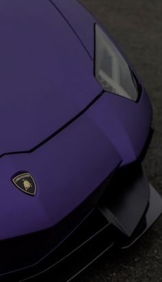 the front end of a purple sports car