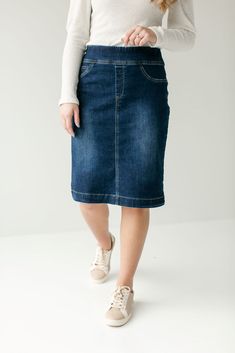 Simple lines, classic and comfortable, the 'Sara' is everything a denim skirt should be. This skirt is made from a quality stretch denim and is as comfy as they come! Featuring a wide waistband for extra comfort and ease of styling. Exclusively designed by us for you. 85% Cotton 12% Polyester 3% Spandex Machine Wash Cold Do Not Bleach Hang to Dry Low Iron if Needed Do Not Dry Clean Functional Back Pockets Available in 21", 24", and 26" length Model A Height 5'8" | Wearing Size 10 in 26" Length M Dark Denim Skirt, Everyday Skirts, Denim Skirts Knee Length, Long Denim Skirt, Denim Skirt Women, Denim Skirts, Nursing Clothes, Knee Length Dresses, Knee Length Skirt