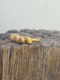 This is a beutifull 14 karat gold plated brass, woman's ring. a rock shape ring with a rustic look. It is a statement ring in a matt finish. -14 k gold plated brass -free shipping worldwide -gift box If you would like to see other rings I have made, please follow this link: https://www.etsy.com/il-en/shop/TamyZurTachshit?ref=seller-platform-mcnav&section_id=17271018 If you would like to go back to my store follow this link: https://www.etsy.com/il-en/shop/TamyZurTachshit?ref=seller-platform- Matte Gold Brass Rings As Gifts, Unique Gold Stackable Rings For Gift, Unique Faceted Gold Rings, Unique Hand Forged Gold Stackable Rings, Matte Gold Brass Rings For Gift, Gold Hand Cast Rings For Gifts, Hand Cast Gold Rings For Gift, Faceted Gold Open Ring Jewelry, Gold Faceted Open Ring Jewelry