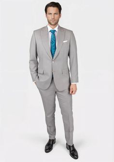 Discover timeless elegance with the Thompson Harbor Grey Suit. Featuring a classic grey with a hint of color in a sharkskin weave, this luxury, custom-made suit is a fashion-forward bespoke piece perfect for making a sophisticated impression. Feel exclusive in this tailored work of art. Elegant Gray Double Breasted Suit For Semi-formal Occasions, Gray Notch Lapel Tuxedo For Formal Occasions, Gray Notch Lapel Tuxedo For Formal Events, Gray Tuxedo Suit For Formal Occasions, Semi-formal Gray Tuxedo With Notch Lapel, Gray Notch Lapel Tuxedo, Gray Notch Lapel Tuxedo For Semi-formal Events, Gray Notch Lapel Tuxedo For Semi-formal Occasions, Gray Fitted Three-piece Suit