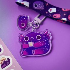 a purple keychain with a cartoon character on it