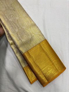 Bridal Collection Beige Color Pure Kanchipuram Silk Saree | Indian Traditional Ethnic Saree | Wedding or Party Wear Saree | Handwoven Gift Saree for Her Product Details : Saree Type : Pure Kanchipuram Silk Saree Golden Zari, Silk Mark Certified Blouse Piece : Yes (Un-Stitched) Saree Length : 5.5 Meters Blouse Piece Length : 80 cm Saree Weight : 0.9 kg Saree Fabric : Pure Kanchipuram Silk  Color : As shown in the picture Work : weaving Pattern : designer Occasion: Party Wear, Formal Wear, Festiva Gold Traditional Wear With Cutdana For Transitional Season, Gold Churidar For Wedding And Navratri, Gold Churidar With Cutdana In Traditional Drape, Traditional Gold Churidar With Cutdana Details, Gold Churidar With Cutdana For Ceremonial Occasions, Gold Anarkali Blouse For Wedding, Brocade Saree With Zari Work For Wedding, Elegant Chandbali Lehenga For Puja, Ceremonial Gold Churidar With Cutdana