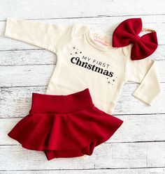 "You may choose: ~\"My First Christmas\" bodysuit as shown. Available in short or long sleeve. ~Adorable burgundy knit skirted bummie. Created here in our studio. ~Matching bow/headband Copyright © 2008 by ChristiCreations®, LLC. All rights reserved. This design or any portion thereof may not be reproduced or used in any manner whatsoever without the express written permission of ChristiCreations®, LLC. Duplication of intellectual property is illegal and all infringements are subject to fines an Santa Photos Outfit, Baby Christmas Outfits, Baby Girl Christmas Dress, Baby Christmas Dress, My First Christmas Outfit, First Christmas Outfit, Christmas Bodysuit